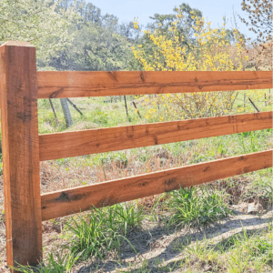 photo of three rail post and rail fence finished in Natural Timber Oil