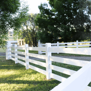 photo of three rail post and rail fence finished in SaltraGuard White