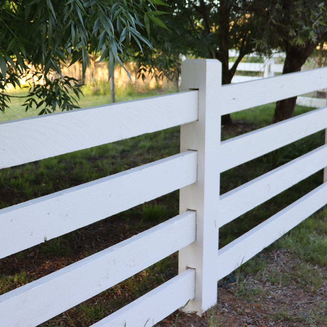 photo of timber post and rail fence finished in Dulux White Weathershield