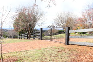 photo of three rail timber post and rail fence finished in Kentucky Horse Black, by Saltram Rural